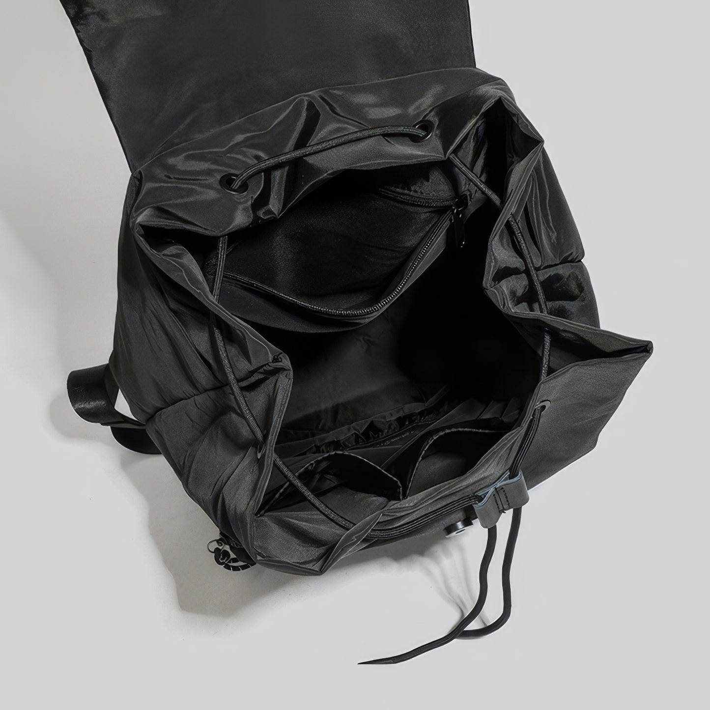 Matte Nylon Drawstring Flap Backpack